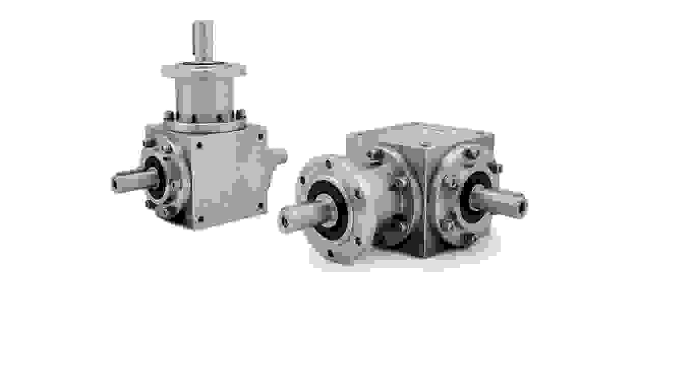 Two spiral bevel gearboxes of cast iron on a transparent background