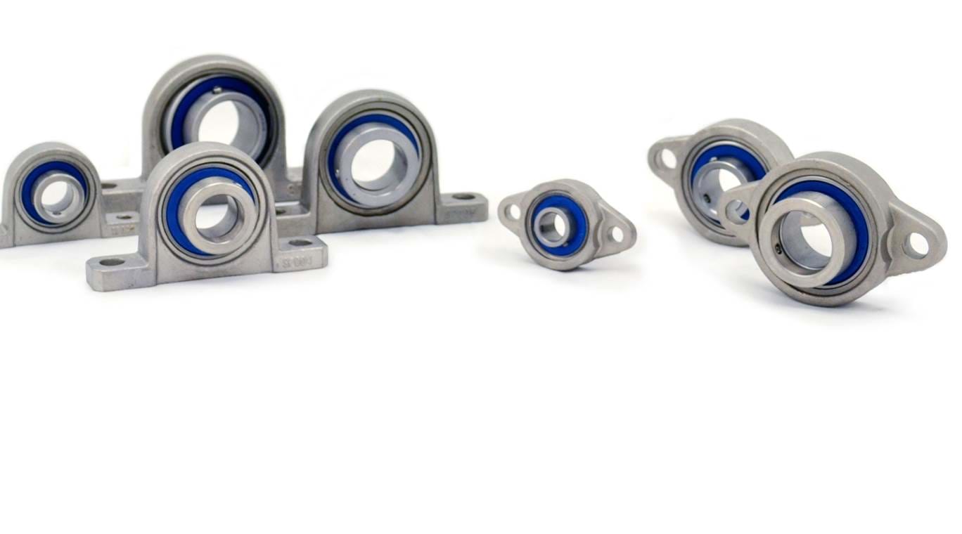  Different types and sizes of mini stainless steel bearings on white background
